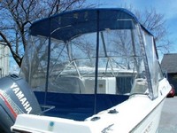 Photo of Aquasport 215 Dual Console, 1996: Bimini Top, Bimini Connector, Side Curtains, Aft-Drop-Curtain, viewed from Starboard Rear 
