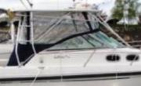 Photo of Boston Whaler Conquest 28, 2000: Hard-Top, Front Visor, Side Curtains, Aft-Drop-Curtain, viewed from Starboard Side 