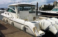 Photo of Boston Whaler Conquest 345 Pilot House, 2016: Hard-Top Aft-Drop-Curtain White Stamoid, viewed from Starboard Rear 