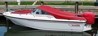 Photo of Boston Whaler Dauntless 17, 1997:, Bow Cover Cockpit Cover to Top of WindShield Jockey Red Sunbrella, viewed from Port Side 