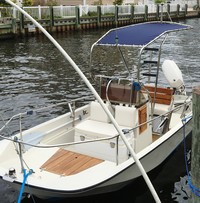 Photo of Boston Whaler Montauk 17, 1985: Montauk T-Topless™ Folding T-Top (MT2) in Captain-Navy Sunbrella, viewed from Port Front 