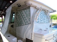 Photo of Boston Whaler Outrage 320 Center Console, 2013: Canvas Wing Curtains, Aft Helm Enclosure Curtains with protective sheet 