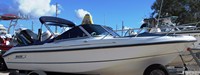 Photo of Boston Whaler Ventura 18, 2001: Bimini Top in Boot, Bow Cover Cockpit Cover, viewed from Starboard Front 