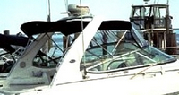 Photo of Chaparral 290 Signature Canvas Under Arch, 2005: Bimini Top, Front Connector, Side Curtains, Camper Top, viewed from Starboard Rear 