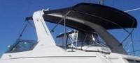 Photo of Formula 280 SS Arch, 2006: Arch Bimini Top, Camper Top black, viewed from Port Rear 