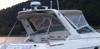Photo of Formula 31 PC, 2001: Bimini, Front Connector, Side Curtains, Camper Top in Boot, viewed from Starboard Rear 