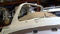 Photo of Four Winns Vista 268, 2002: Cockpit Cover with Bimini Frame Cutouts, viewed from Starboard Front 