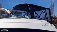 Photo of Glastron GS 259, 2007: No Arch Bimini Top, Front Connector, Side Curtains, Camper Top, Camper Side and Aft Curtains, viewed from Port Front 