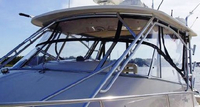 Photo of Grady White Express 330, 2007 Front Visor, Side Curtains, Aft-Drop-Curtain Sunbrella Fabric, viewed from Port Front 