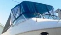 Photo of Larson Cabrio 270, 1997: Bimini Top, Connector, Side Curtains, Aft Curtains, viewed from Starboard Front 