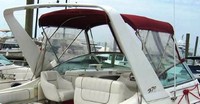 Photo of Larson Cabrio 270, 1998: Arch Bimini Top, Connector, Side Curtains, viewed from Starboard Rear 