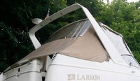 Photo of Larson Cabrio 270, 2000: Arch Bimini Top, Side Curtains, Aft Curtain, viewed from Starboard Rear 