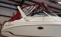Photo of Larson Cabrio 290, 1998: Bimini Top, Front Connector, Side Curtains, Aft-Drop-Curtain, viewed from Starboard Side 