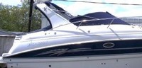 Photo of Larson Cabrio 330, 2007: Factory Arch Bimini Top in Boot Connections Cockpit Cover, viewed from Starboard Side 