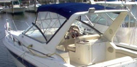 Photo of Monterey 276 Cruiser Arch, 1997: Bimini Top, Front 3 Panel Visor, Side Curtains, viewed from Port Rear 