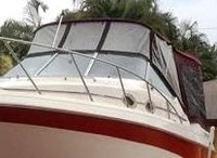 Photo of Monterey 276 Cruiser No Arch, 1997: Bimini Top, Front 3 Panel Visor, Side Curtains, Camper Top, Camper Side and Aft Curtains, viewed from Port Front 