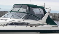 Photo of Monterey 296 Cruiser Under Arch, 1996-2000: Bimini Top, Front Visor, Side Curtains, Aft Curtain, viewed from Port Front 