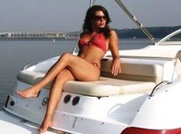 Photo of Nauticstar 230SL Sport Deck, 2007: Bimini Top Frame Gorgeous Model (Factory OEM website photo), viewed from Starboard Rear 