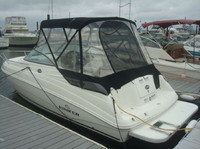 Photo of RInker 230 Atlantic, 2008: Factory OEM Bimini Top, Connector, Side Curtains, Aft Curtains, viewed from Port Rear 