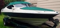 Photo of Regal 2100 LSR, 1997: Convertible Top Convertible Aft Curtain, Bow Cover Forest Green Sunbrella, viewed from Starboard Front 