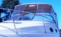Photo of Regal Commodore 258, 1998: Bimini Top, Front Connector, Side Curtains, Camper Top, Camper Side Curtains, viewed from Port Front 