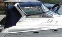 Photo of Regal Commodore 2760, 2001: Radar Arch Bimini Top, Front Visor, Side Curtains, Camper Top, Camper Aft Curtain, viewed from Starboard Side 