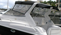 Photo of Regal Commodore 2860, 2005: Bimini Top, Front Visor set, Side Curtains, Camper Top, viewed from Port Rear 