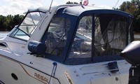 Photo of Regal Commodore 300 Arch, 1994: Bimini Top, Visor, Side Curtains, Camper Top, Camper Side and Aft Curtains, viewed from Port Rear 