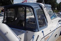 Photo of Regal Commodore 300 Arch, 1994: Bimini Top, Visor, Side Curtains, Camper Top, Camper Side and Aft Curtains, viewed from Starboard Rear 