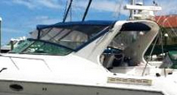 Photo of Regal Commodore 400, 1993: Bimini Top, Front Visor, Side Curtains, viewed from Port Side 
