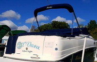 Photo of Rinker 250 Fiesta Vee, 2004: Bimini Top in Boot, Cockpit Cover, viewed from Starboard Rear 