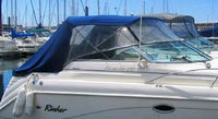 Photo of Rinker 270 Fiesta Vee, 1999: Factory OEM Bimini Top, Side Curtains, Aft-Drop-Curtain, viewed from Starboard Front 