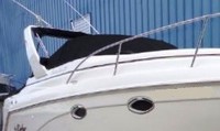 Photo of Rinker 270 Fiesta Vee, 2002: Radar Arch Bimini Top in BootCockpit Cover, viewed from Starboard Front 