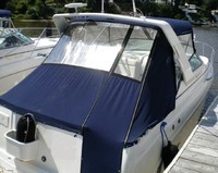 Photo of Rinker 270 Fiesta Vee, 2003: Bimini Top under Radar Arch, Front Visor, Side Curtains, Aft Curtain, viewed from Starboard Rear 