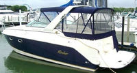 Photo of Rinker 270 Fiesta Vee, 2004: Bimini Connector, Side Curtains, Camper Top, Camper Side Curtains, Camper Aft Curtain, viewed from Port Rear 