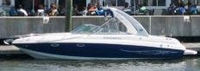 Photo of Rinker 282 Cuddy, 2007: Factory Radar Arch Bimini Top in Boot, viewed from Port Side 