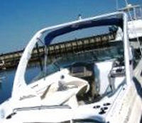 Photo of Rinker 282 Cuddy, 2007: Factory Radar Arch Bimini Top in Boot, viewed from Starboard Rear 