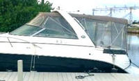 Photo of Rinker 300 Express Cruiser, 2007: Bimini, Front Connector, Side Curtains, Camper Top, Camper Side and Aft Curtains, viewed from Port Side 