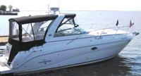 Photo of Rinker 320 Express Cruiser, 2008: Bimini Top, Front Connector, Side Curtains, Camper Top, Camper Side Aft Curtains, viewed from Starboard Side 