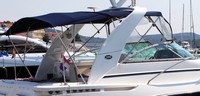 Photo of Rinker 390 Express Cruiser Canvas Tops, 2006: Arch Bimini Top, Bimini Visor, Camper Top, viewed from Starboard Rear 