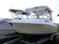 Photo of Robalo 225WA, 2005: Hard-Top Top, Connector, Side Curtains, Aft-Drop-Curtain, viewed from Port Front 