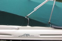 Photo of Sea Ray 215 Express Cruiser, 2000: Bimini Top in Boot, Cockpit Cover Frame Cutout Details, viewed from Port Side 
