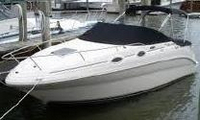 Photo of Sea Ray 240 Sundancer, 2004: Cockpit Cover, Bimini Top in Boot, Camper Top in Boot, viewed from Port Front 