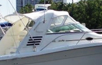 Photo of Sea Ray 330 Express Cruiser, 1997: Bimini Top, Front Visor, Side Curtains, Sunshade Top, viewed from Starboard Side 