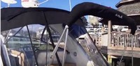 Photo of Sea Ray 330 Sundancer, 2017 Hard-Top, Sunshade Top Aft Enclosure Curtains, Camper Top in Embroidered Boot, viewed from Port Rear close up 