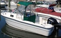Photo of Trophy 1802 WA, 2004: Factory Bimini Top, Front Connector, Side Curtains, Aft-Drop-Curtain, viewed from Port Rear 