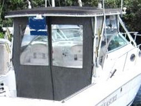 Photo of Wellcraft Coastal 270, 2000: Hard-Top, Front Connector, Side Curtains, Aft-Drop-Curtain, viewed from Starboard Rear 