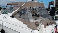 Photo of Wellcraft Martinique 3000, 2001: Bimini Top, Front Connector, Side Curtains, Arch Aft Curtain, viewed from Port Rear 