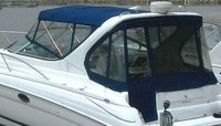 Photo of Wellcraft Martinique 3300, 2000: Bimini Top, Front Connector, Side Curtains, Arch Aft Curtain, viewed from Port Rear 